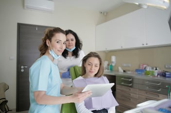 remote nurses reviewing patient data